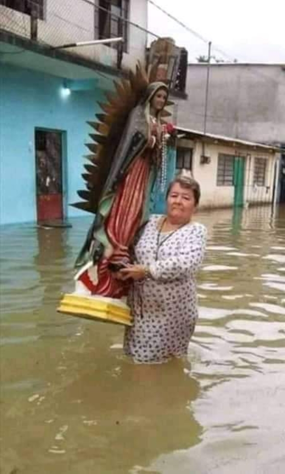 Rev Sis with Virgin Mary's Image inside flood criticized; stirs Dust