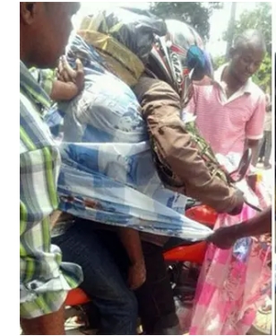 Corpse tied on a Bike in Congo and drive to the Morgue