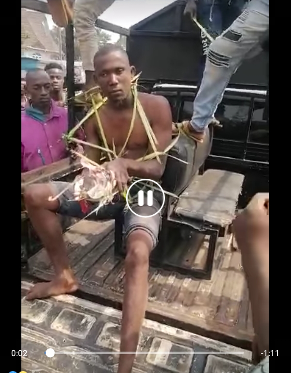 Onyeka being paraded in Oraukwu Community with charms found in his possession.