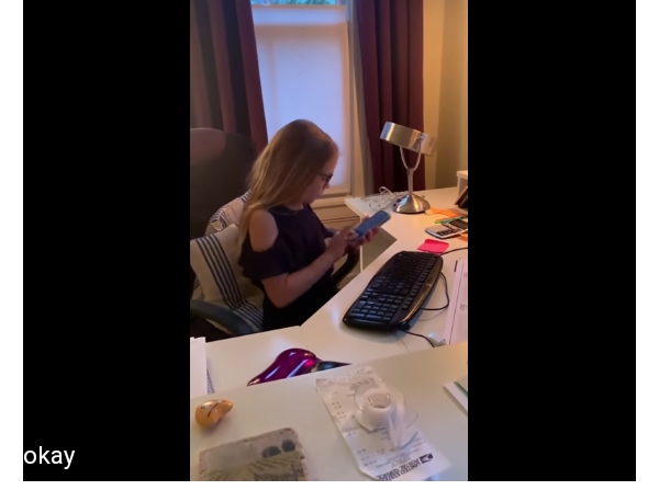8-year-old daughter mimics her Mother working from home