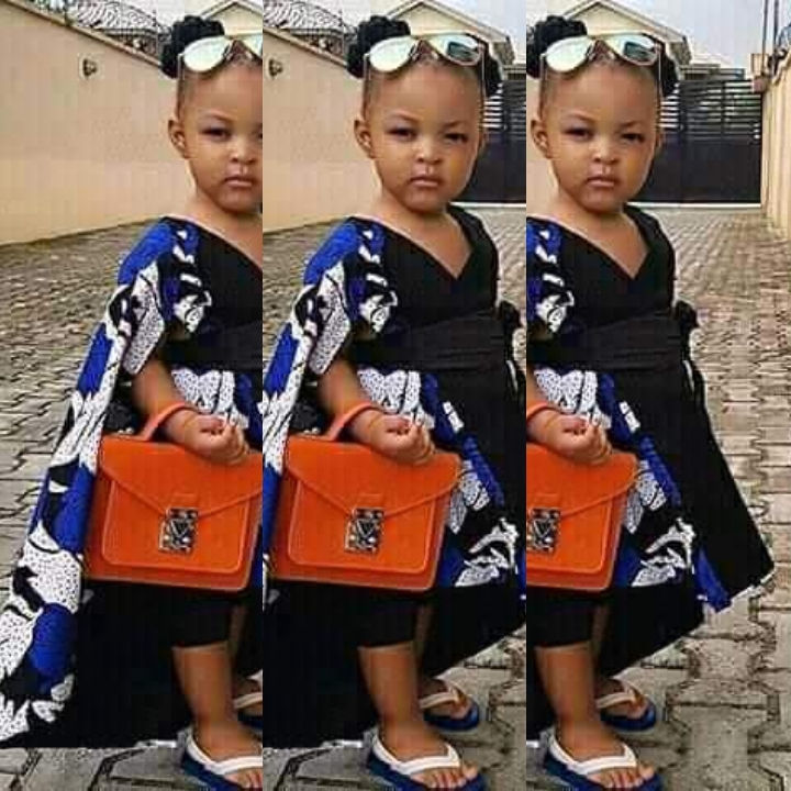 Fashion for Kids: Photo of Little Girl in Stylish Bubu Gown Leaves